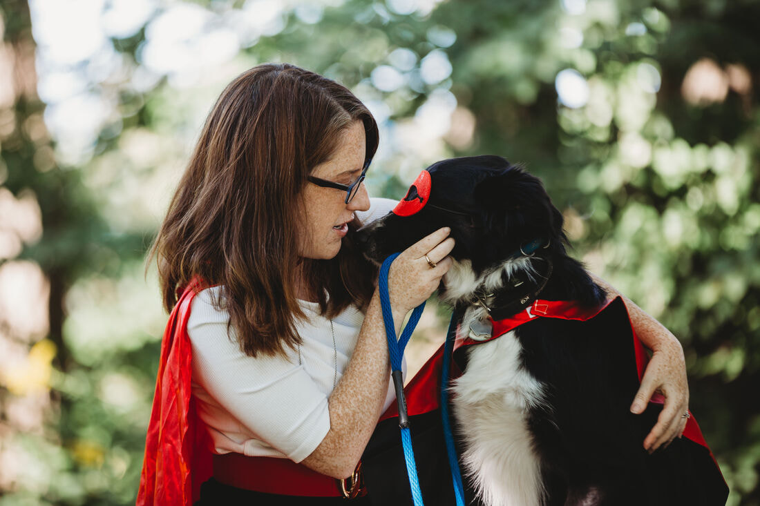 Tara Downs Rocchetti, CFP with her dog Link